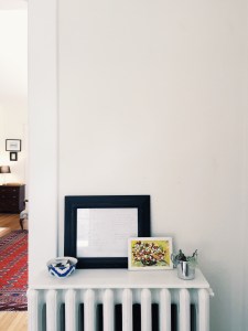 entry (sidenote- yes, our 90 year old house has radiators, so to make them a little more useful, i placed marble slabs on top- insta table!)